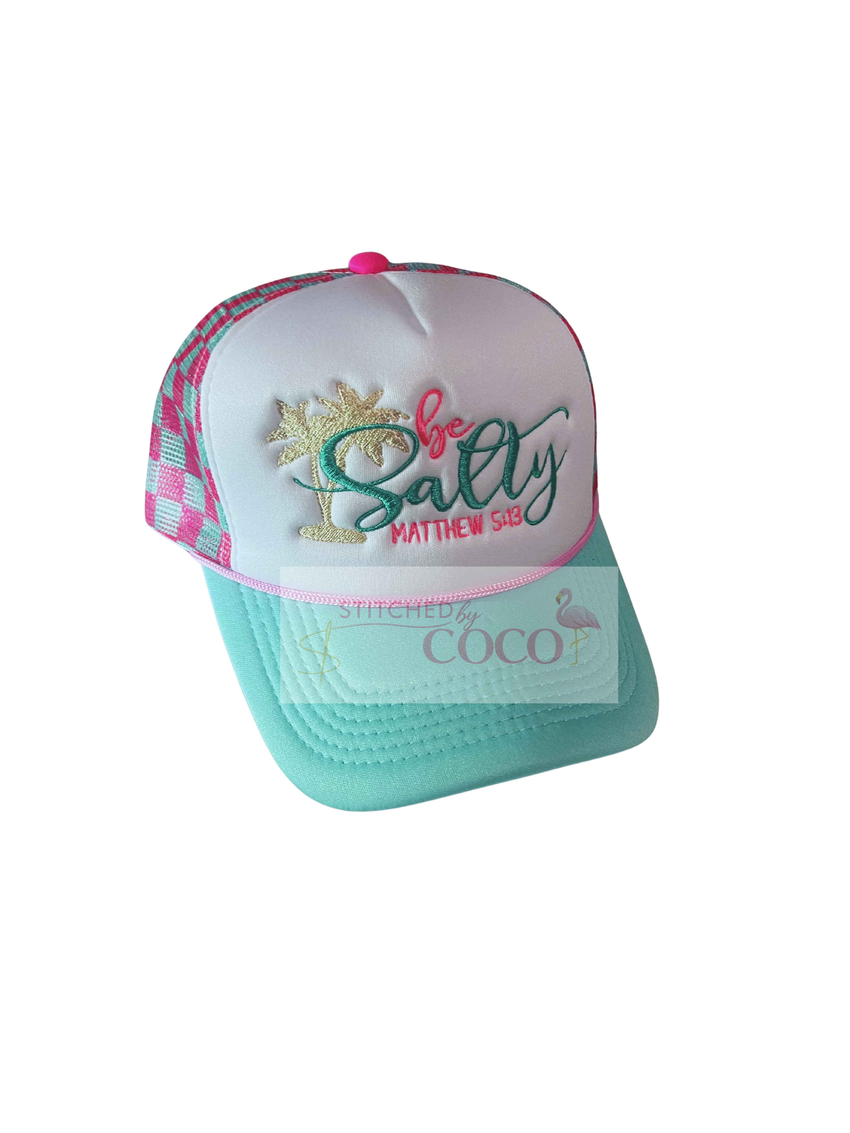 Pink and teal checkered trucker hat featuring embroidered ‘be salty,’ a beige palm tree, and the Bible verse Matthew 5:13 on the front panel