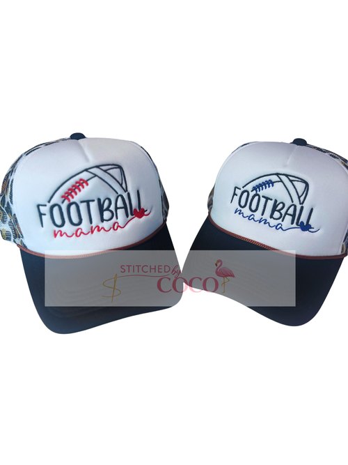 Women’s black and white trucker hat with embroidered ‘Football Mama’ text with a heart, football outline on the front, and a cheetah‑pattern mesh back decorated with footballs.