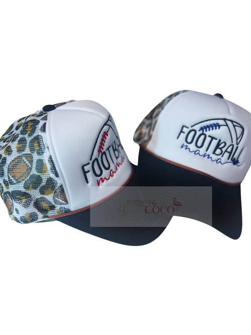 side view. Women’s black and white trucker hat with embroidered ‘Football Mama’ text with heart, football outline on the front, and a cheetah‑pattern mesh back decorated with footballs. Customize to your school colors. 